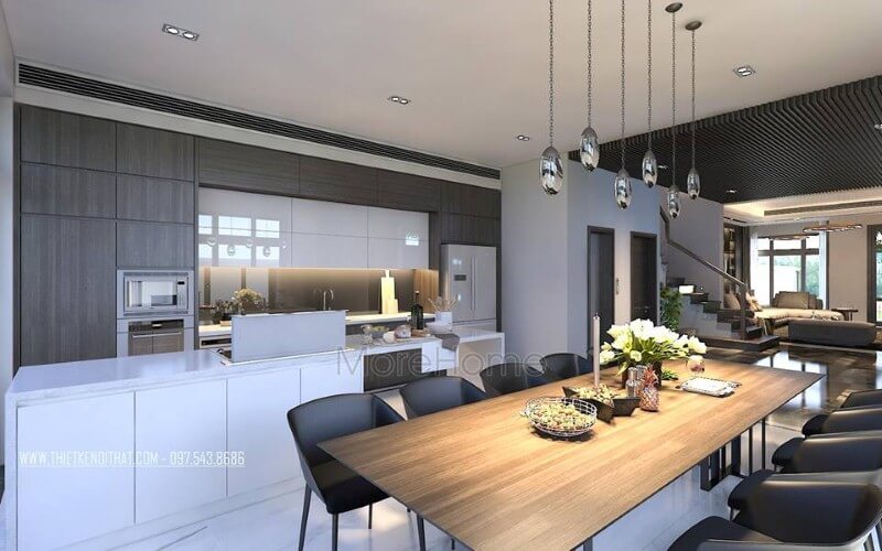 Bàn ăn gỗ nguyên tấm mộc mạc kết hợp đồ nội thất hiện đại sẽ là lựa chọn ấn tượng tạo nên không gian độc đáo cho phòng ăn liền bếp. mẫu bàn ăn gỗ tự nhiên cao cấp cho phòng ăn sang trọng